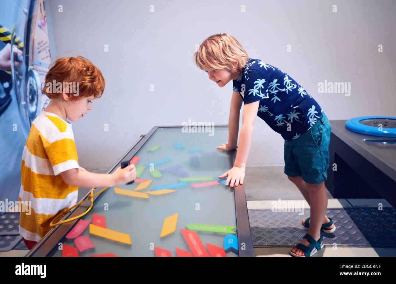 WARSAW, POLAND - June 20, 2019: Kids playing with magnetic words in the Copernicus Science Centre in Warsaw, Poland Stock Photo