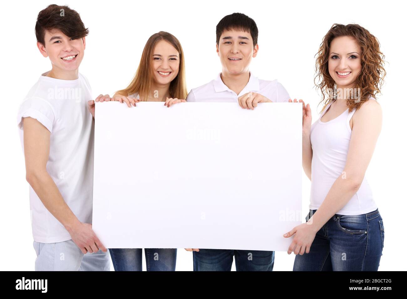 Group of happy young people holding blank poster isolated on white ...