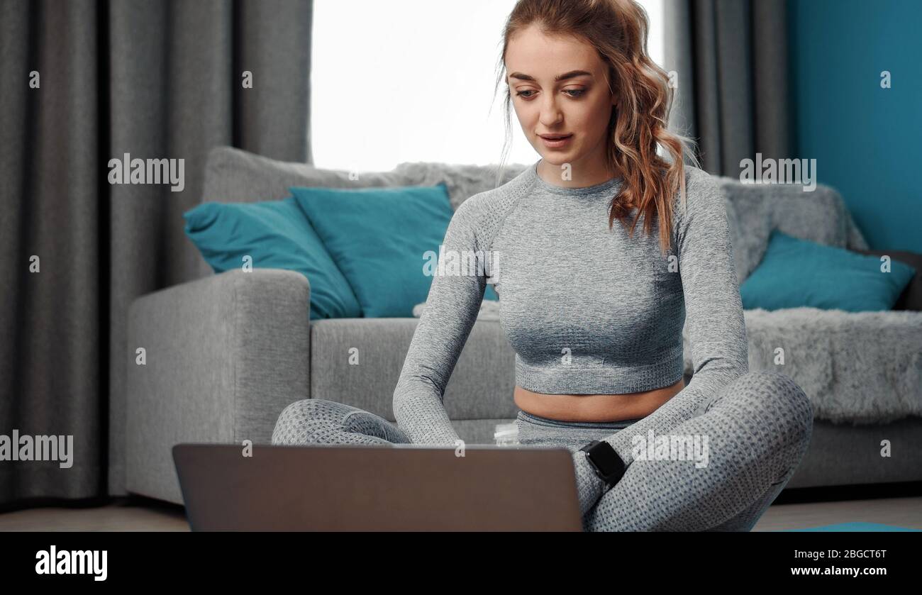 Female selecting tutorial on laptop Stock Photo