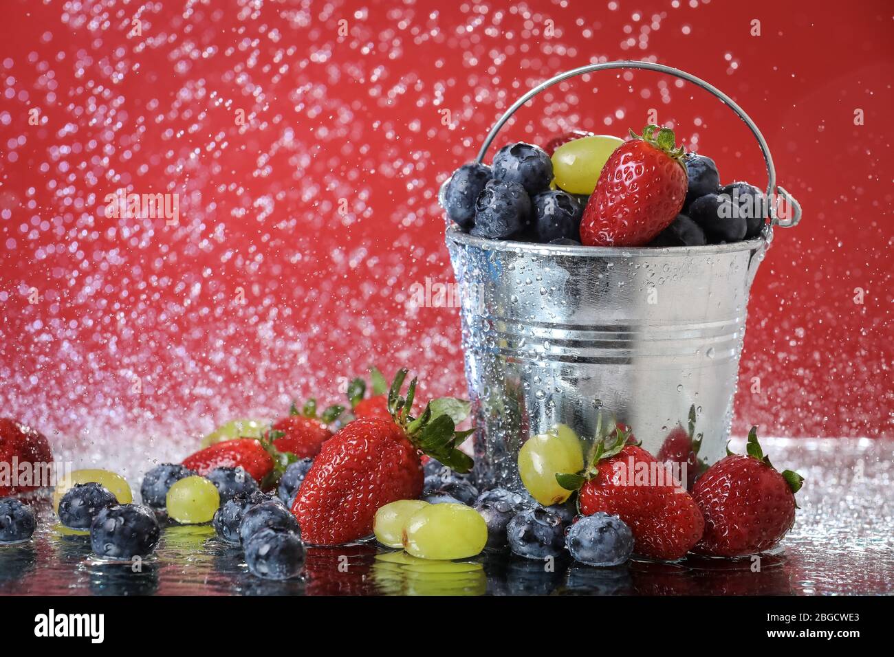 Fruit salad close up in metal bucket. Strawberry, grape, blueberry ... Fruit salad close up in metal bucket. Strawberry, grape, blueberry ...