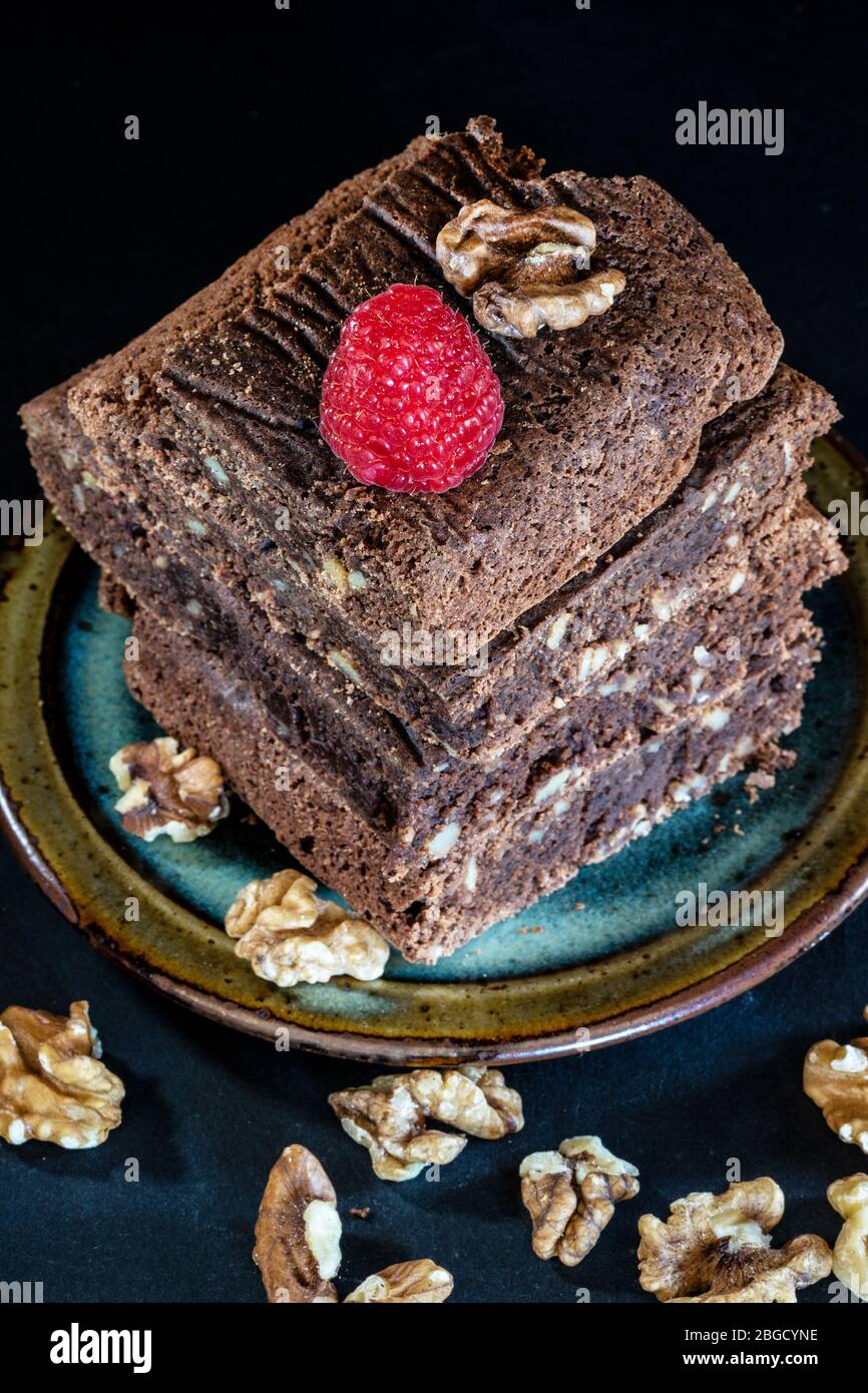 stacked brownie with raspberry Stock Photo Alamy