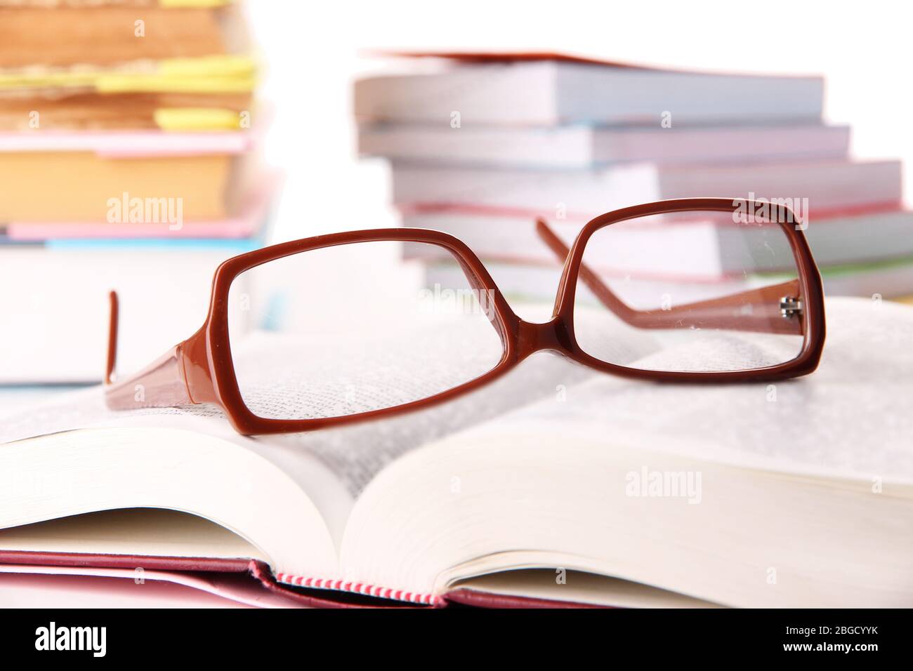 Composition with glasses and books, isolated on white Stock Photo - Alamy