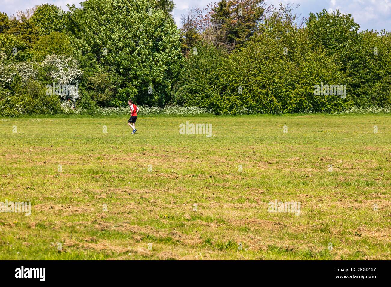 A lone runner on Gillingham Great Lines Park,Gillingham, Kent, UK Stock