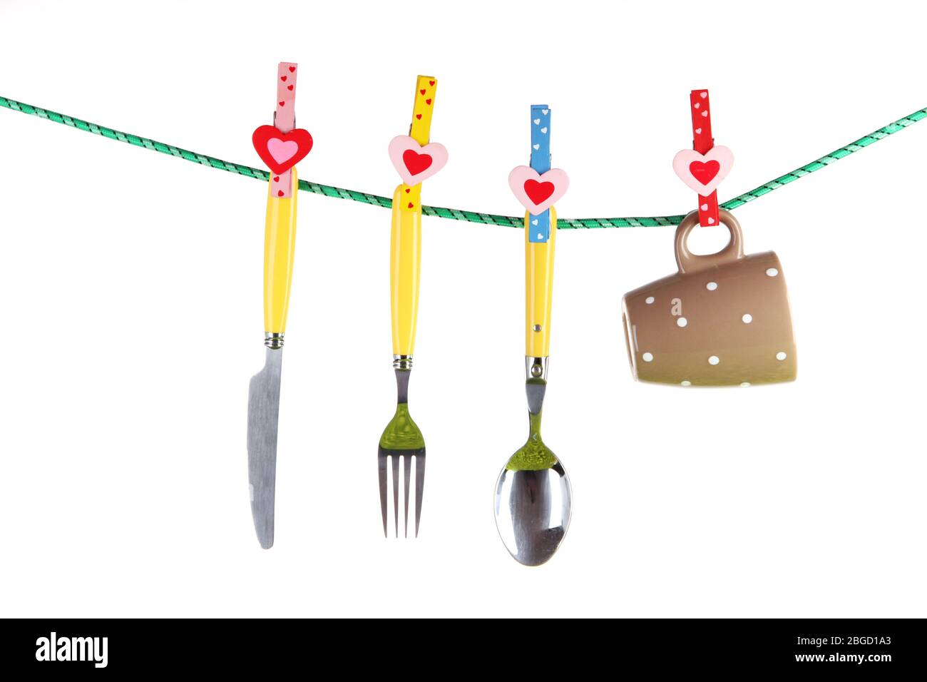 Crockery dried on rope isolated on white Stock Photo Alamy