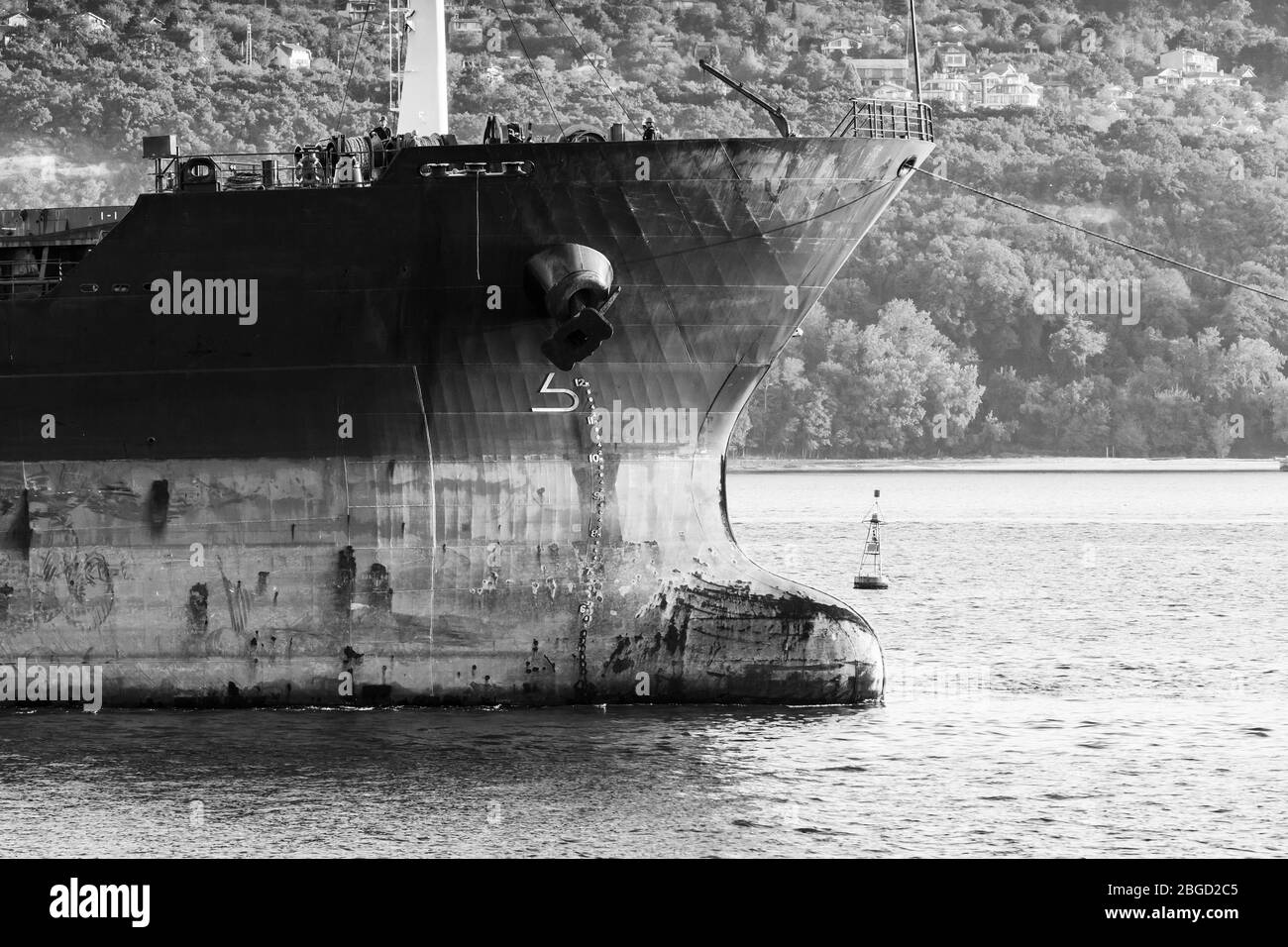 Dark bow of a big industrial cargo ship, black and white photo Stock Photo