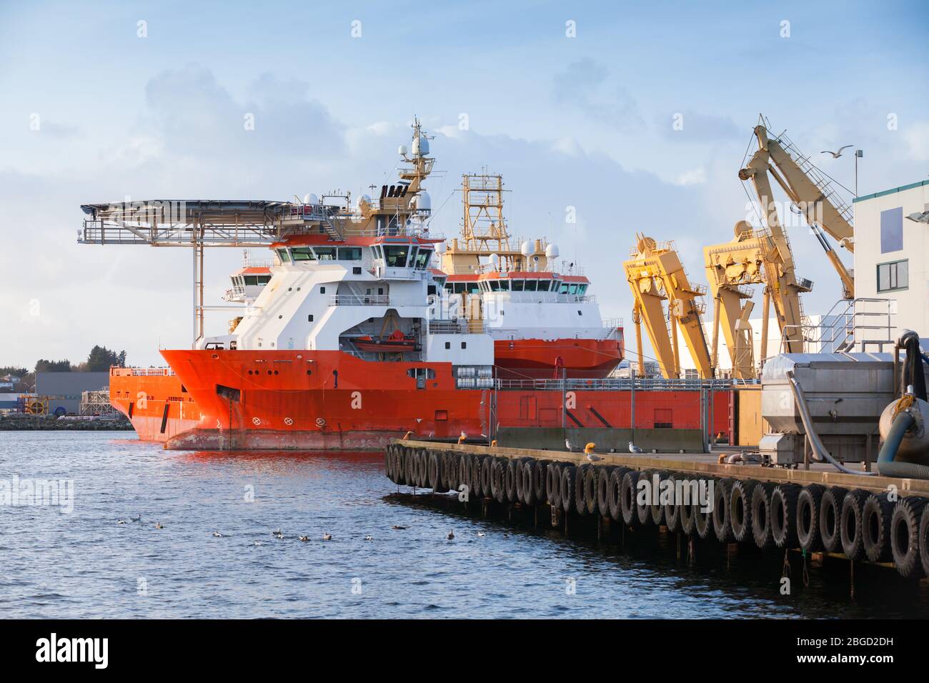 Floating Storage and offshore safety vessels are moored in Norwegian port Stock Photo
