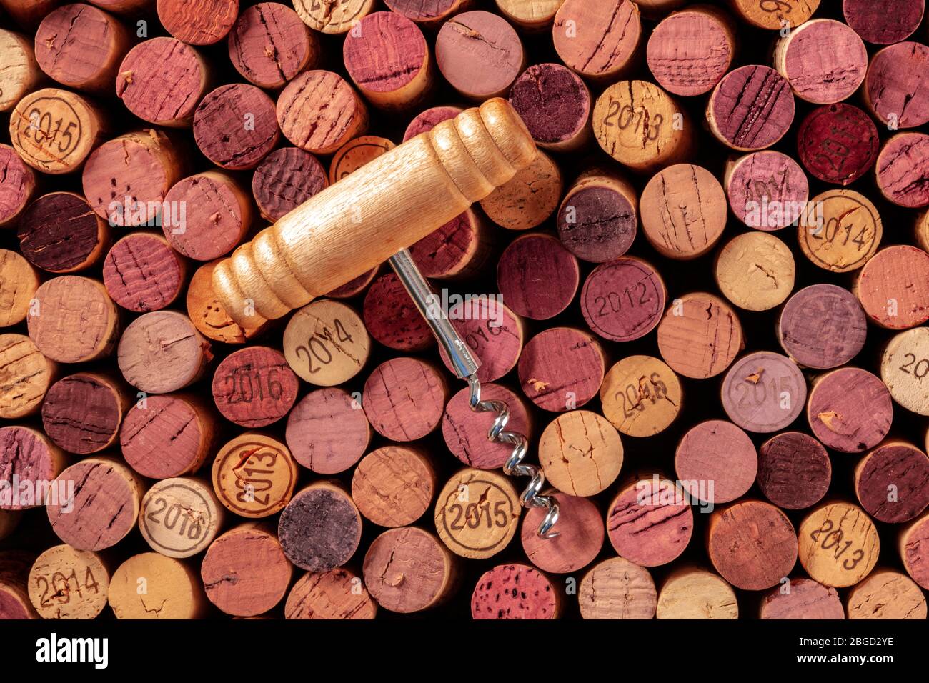 Wine corks with a vintage corkscrew, overhead shot Stock Photo