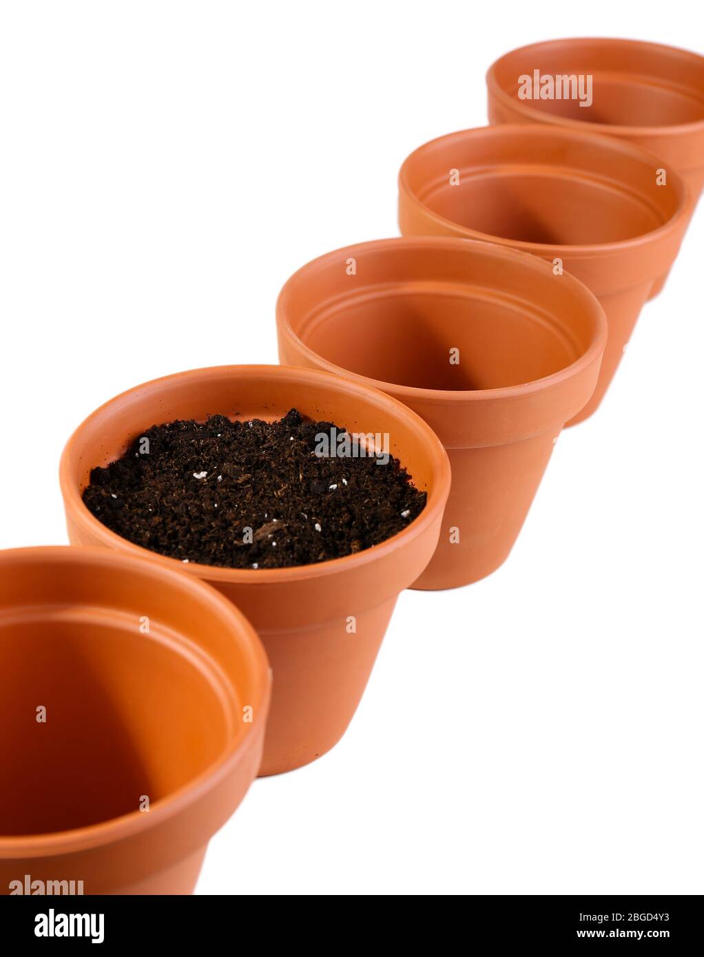 Clay flower pots and soil, isolated on white Stock Photo - Alamy