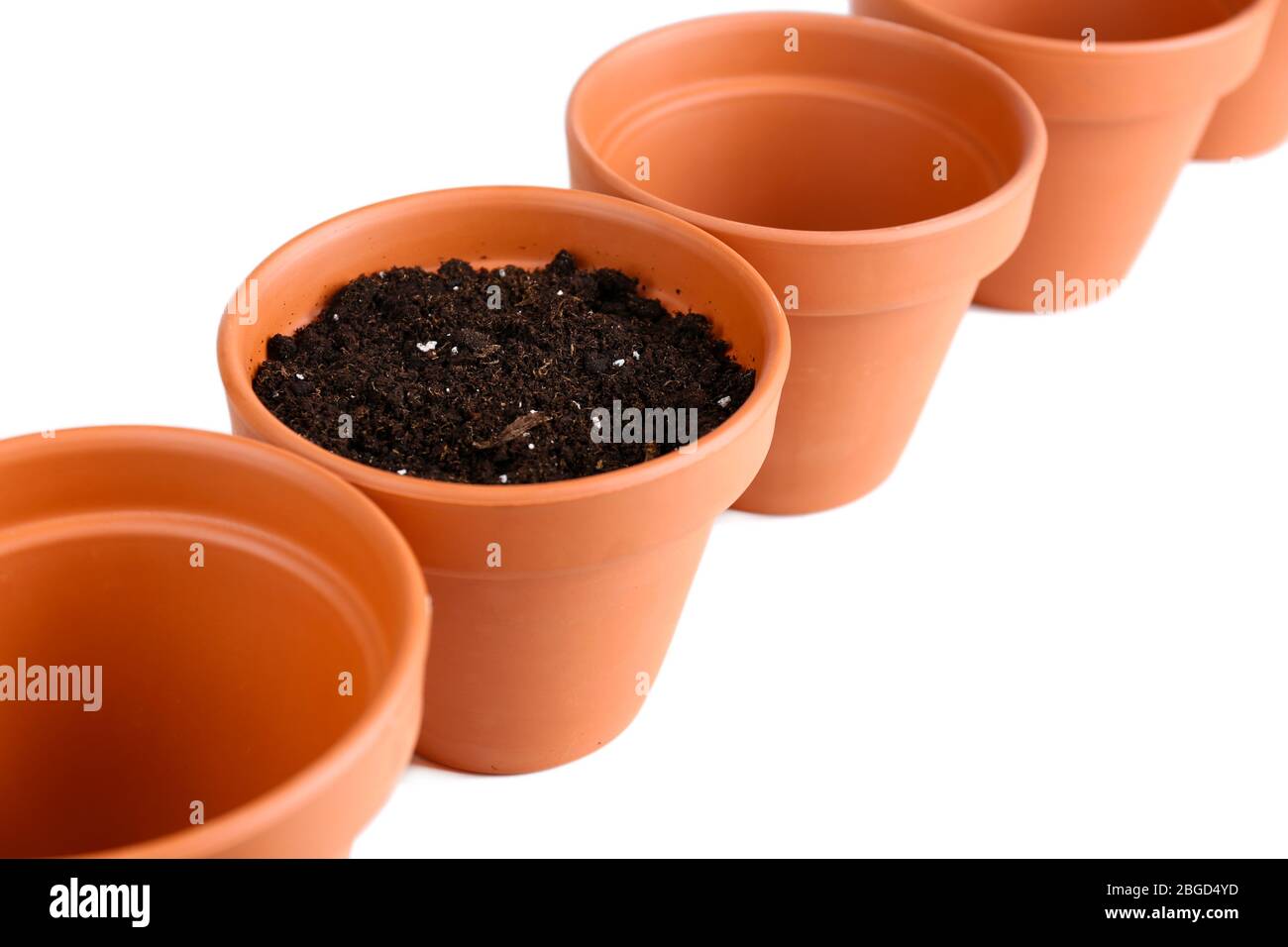 Clay flower pots and soil, isolated on white Stock Photo - Alamy