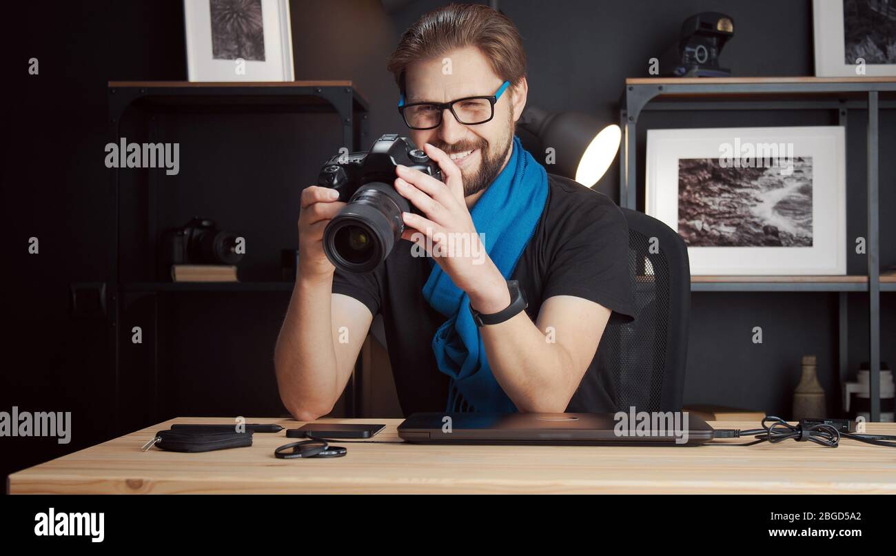Photographer reviewing photos in camera Stock Photo