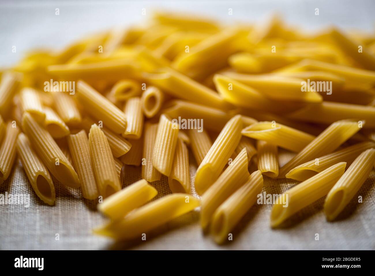 Italian uncooked dry pasta Penne rigate Stock Photo Alamy