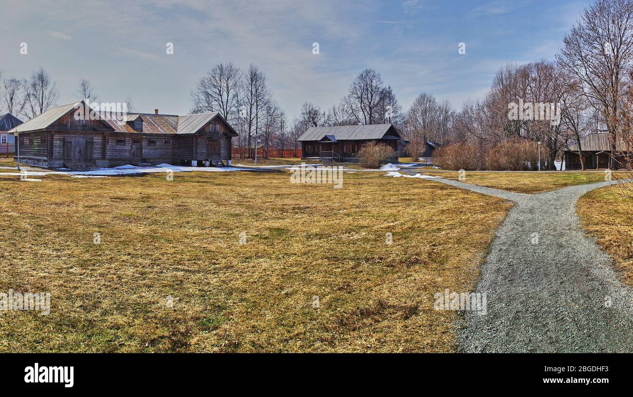 Spring landscape in the park of the estate of the Pushkin family. Visible courtyards: a barn, a stable, a farmyard and a chicken coop. Russia, Stock Photo