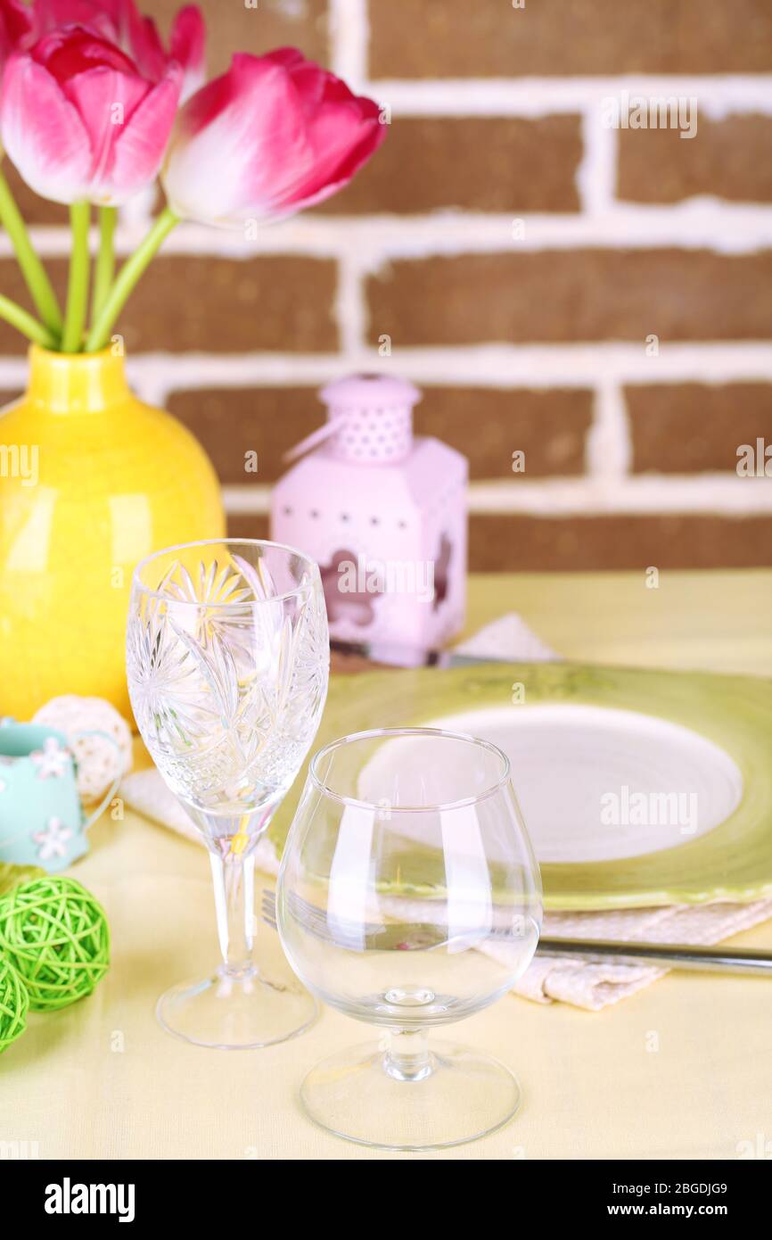 Beautiful spring table setting on bright background Stock Photo - Alamy