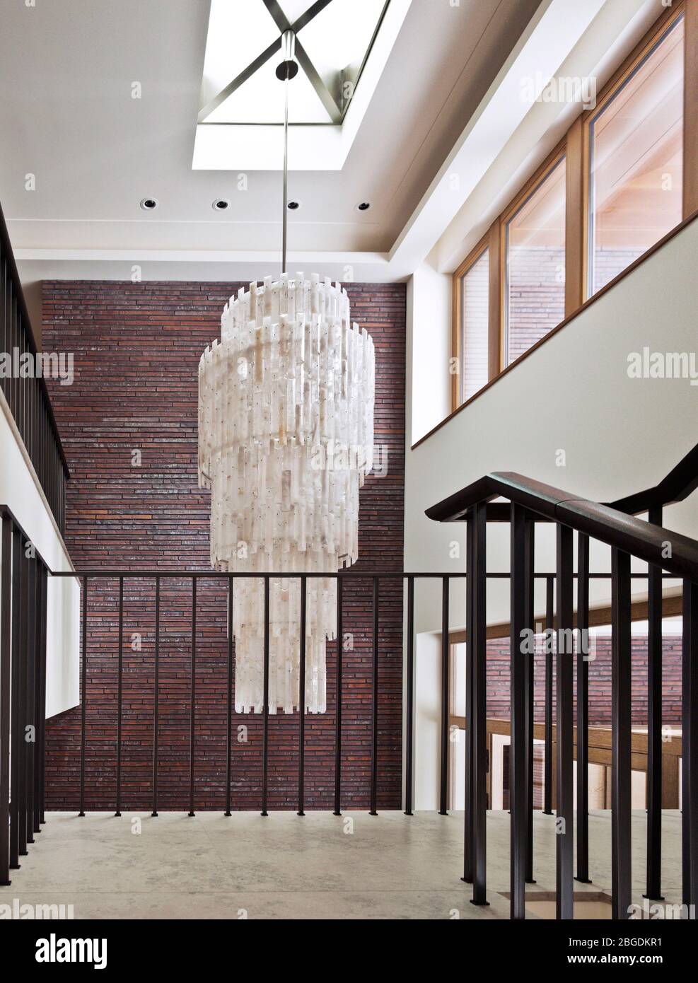 Luxury mansion near Moscow; interior design of a country house; staircase with a crystal chandelier Stock Photo