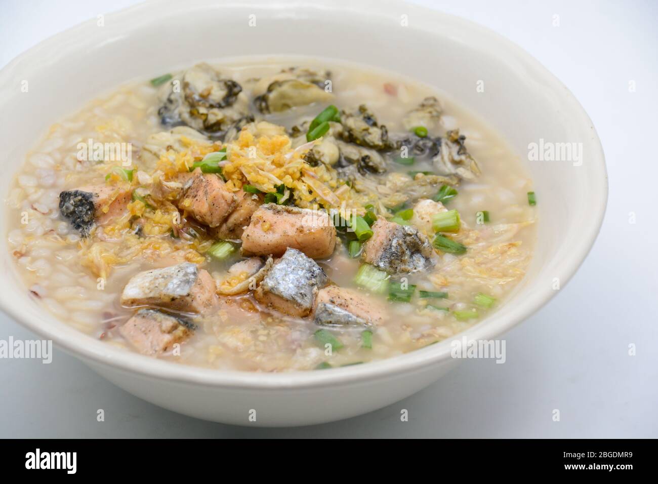 Seafood boiled rice with Salmon and Oysters Stock Photo - Alamy