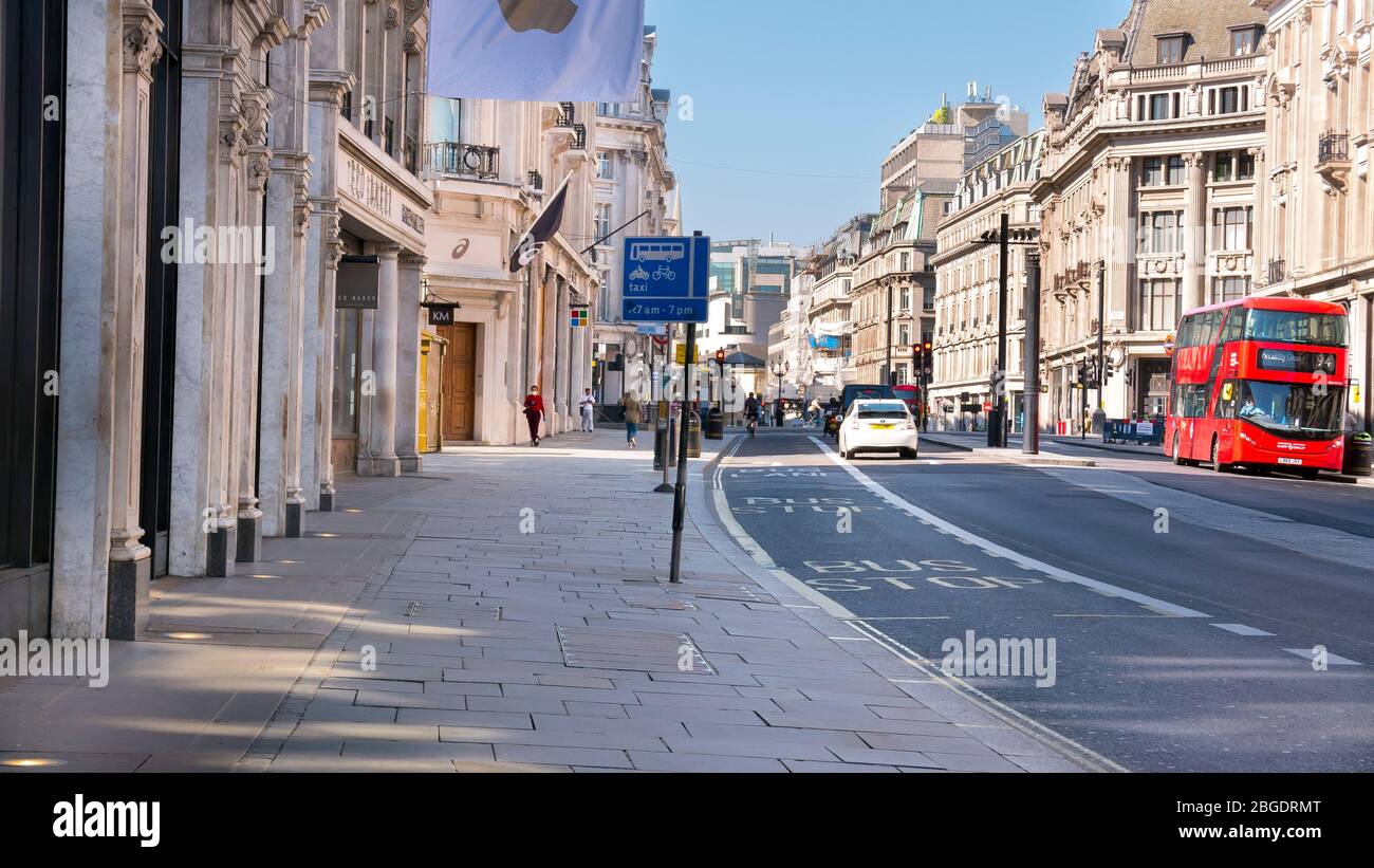 Coronavirus Pandemic a view  of Regent Street in London  April 2020. No people only a few buses in the streets, all shops closed for Lockdown. Stock Photo