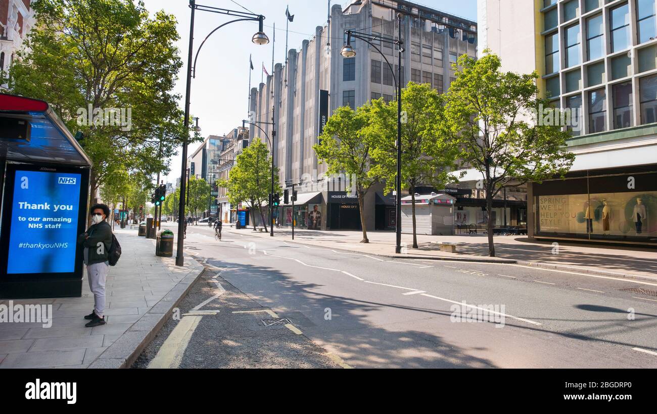 Coronavirus Pandemic . Oxford Street in London  April 2020. No people only a few buses in the streets, all shops closed for Lockdown. Stock Photo