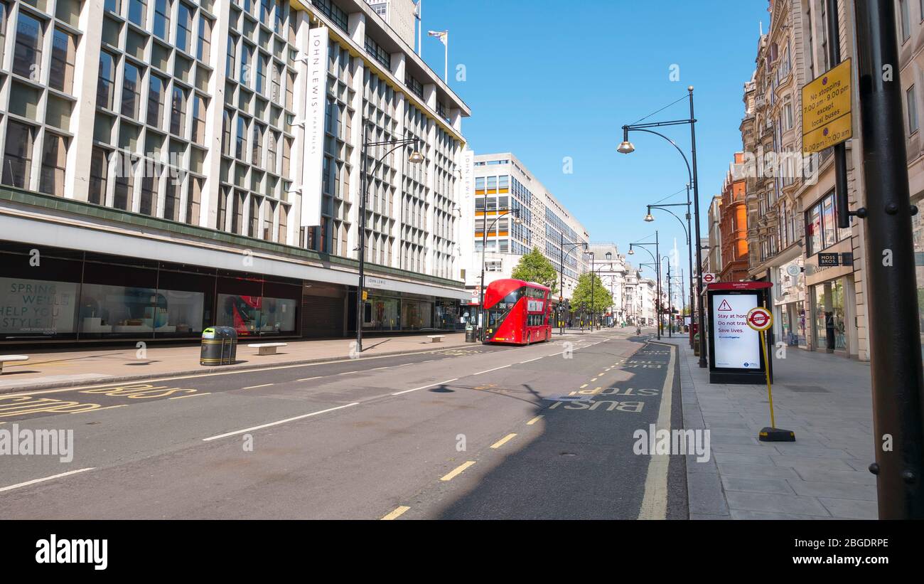 Coronavirus Pandemic a view  of Oxford Street in London  April 2020. No people only a few buses in the streets, all shops closed for Lockdown. Stock Photo