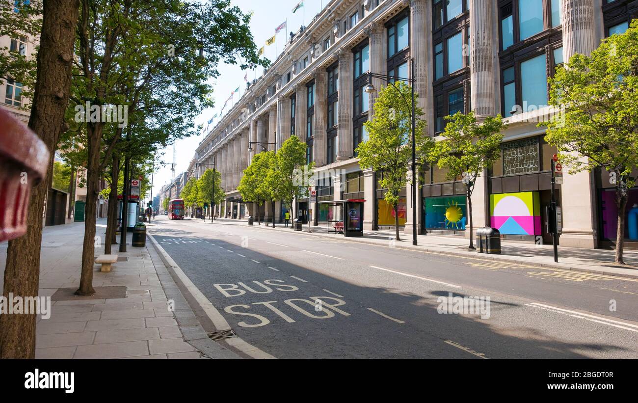 Coronavirus Pandemic a view  of Oxford Street in London  April 2020. No people only a few buses  in the streets, all shops closed for Lockdown. Stock Photo