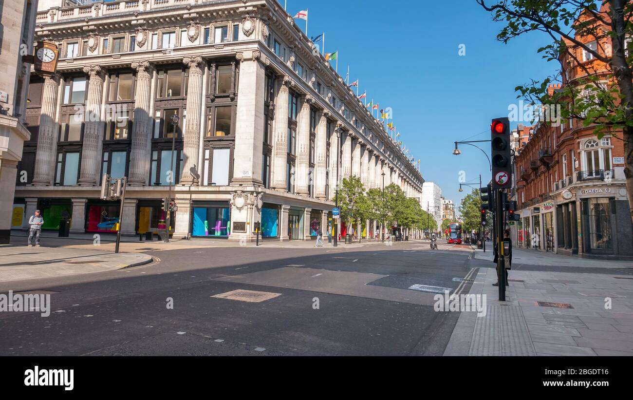 Coronavirus Pandemic a view of Oxford Street in London  April 2020. No people only a few buses  in the streets, all shops closed for Lockdown. Stock Photo