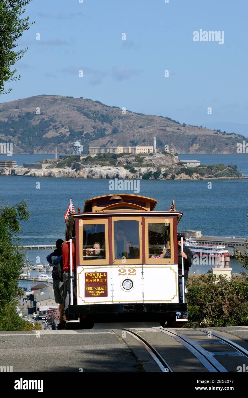 Cable Car on Hyde Street, in the background the prison island Alcatraz, San Francisco, California, USA Stock Photo