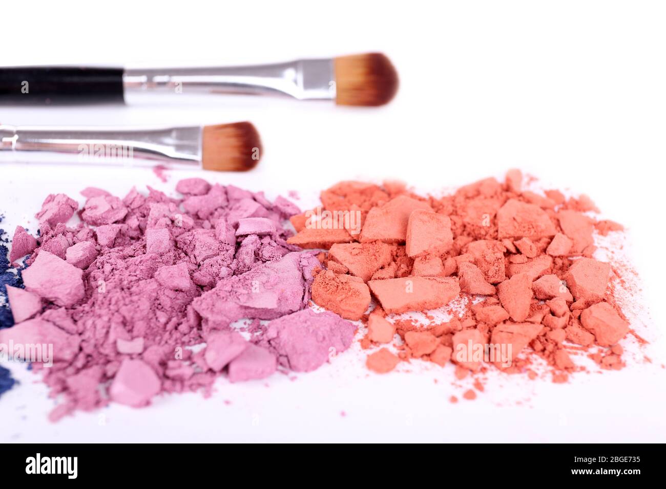 Crushed eyeshadow with brushes isolated on white Stock Photo Alamy