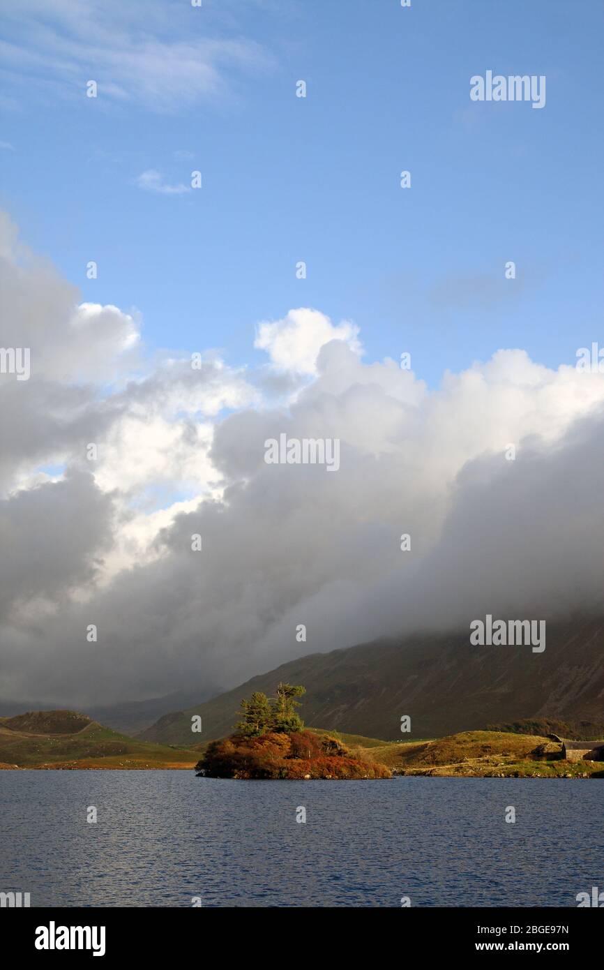 Cregennan Lake - Llynnau Cregennan - Gwynedd, Wales. The island as the sky clears. Stock Photo