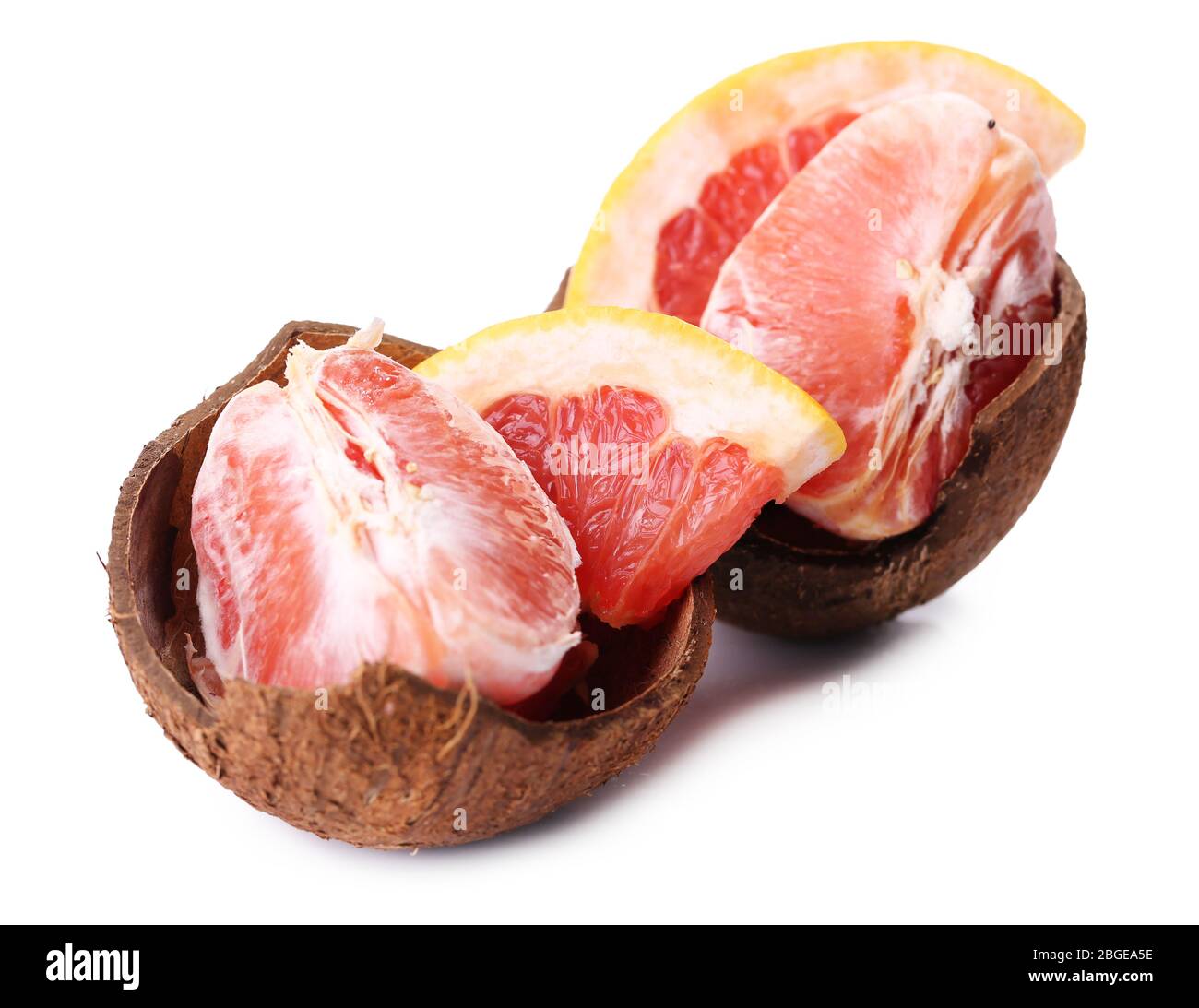 Grapefruit slices in coconut shell isolated on white Stock Photo - Alamy