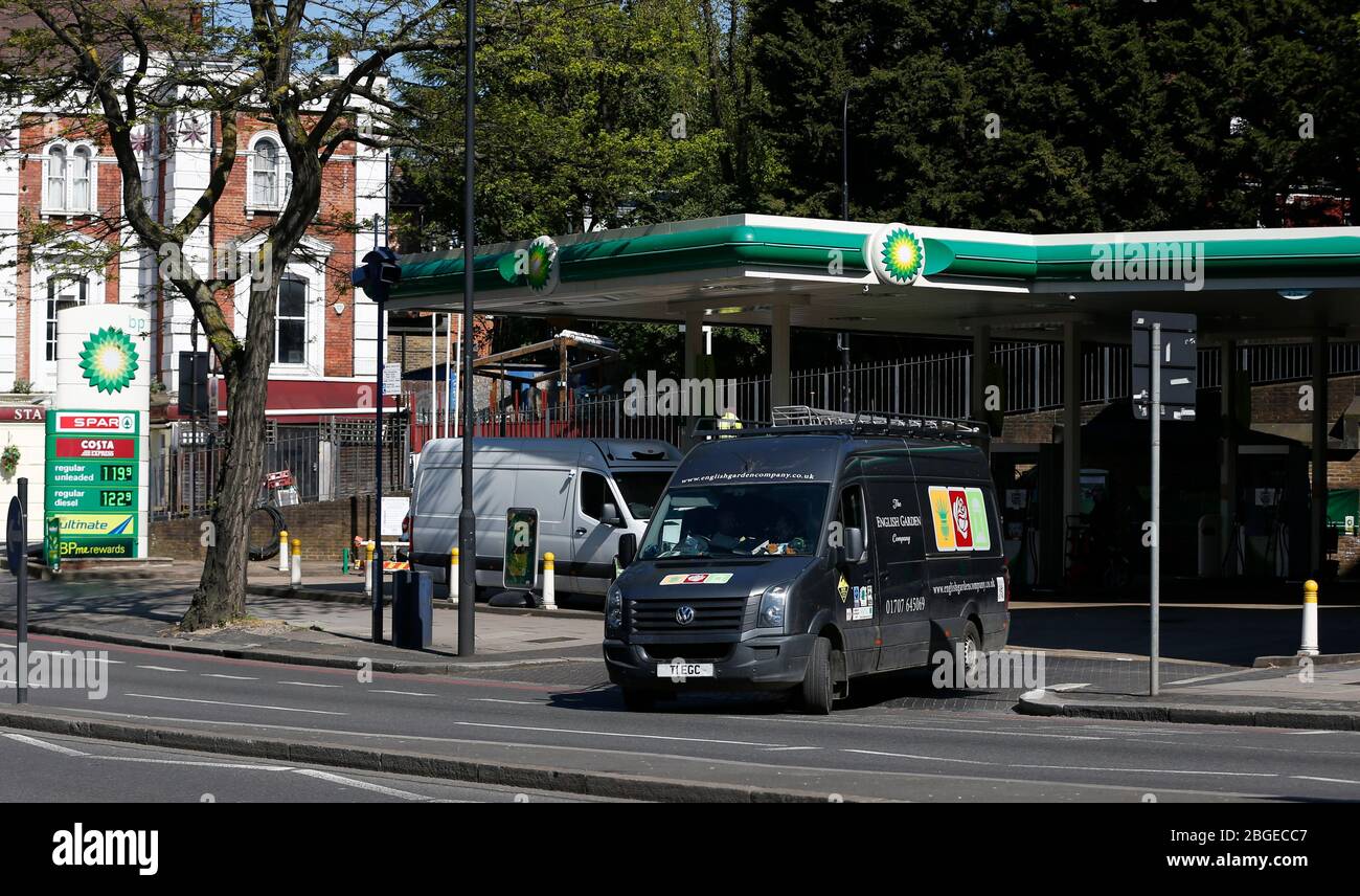 London, UK. 21st Apr, 2020. A van leaves a petrol station in London, Britain on April 21, 2020. Brent crude plummeted to 22 U.S. dollars a barrel at one point Tuesday morning as global oil demand collapses because of lockdown in many countries to tackle the coronavirus pandemic. Credit: Han Yan/Xinhua/Alamy Live News Stock Photo