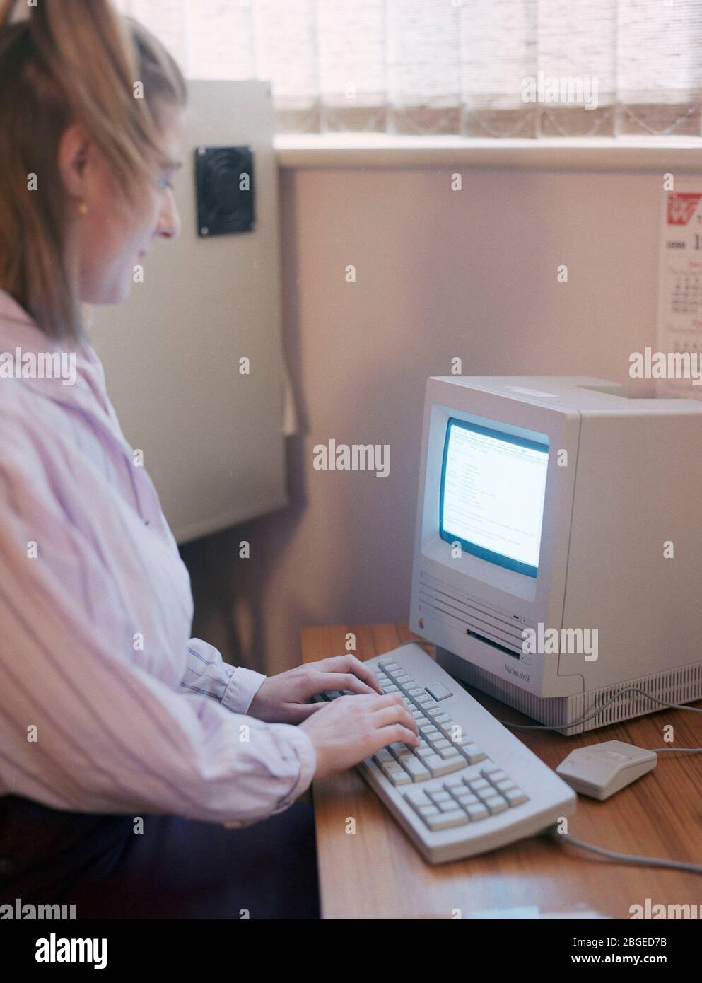 Workers in a typical 1990 office, UK Stock Photo