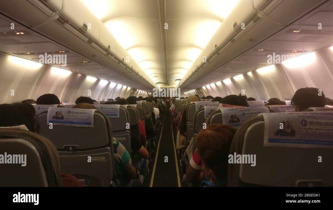 Bengaluru, Karnataka / India - October 18 2019: Dim view of a fully occupied passenger aircraft cabin ready for take off Stock Photo
