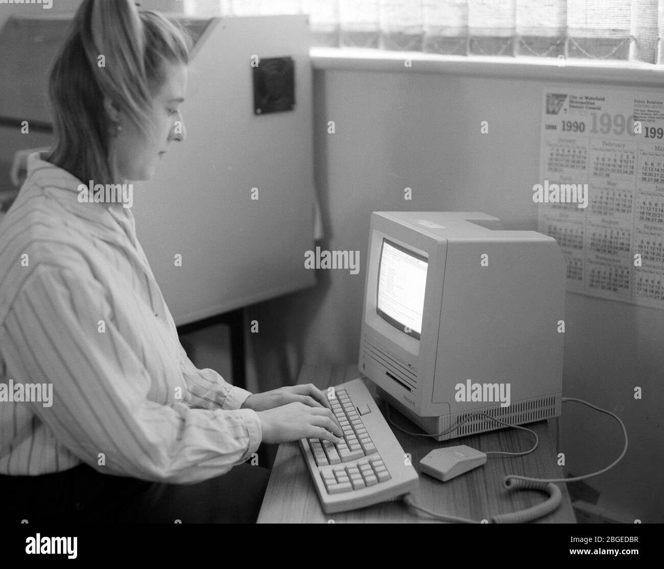 Workers in a typical 1990 office, UK Stock Photo