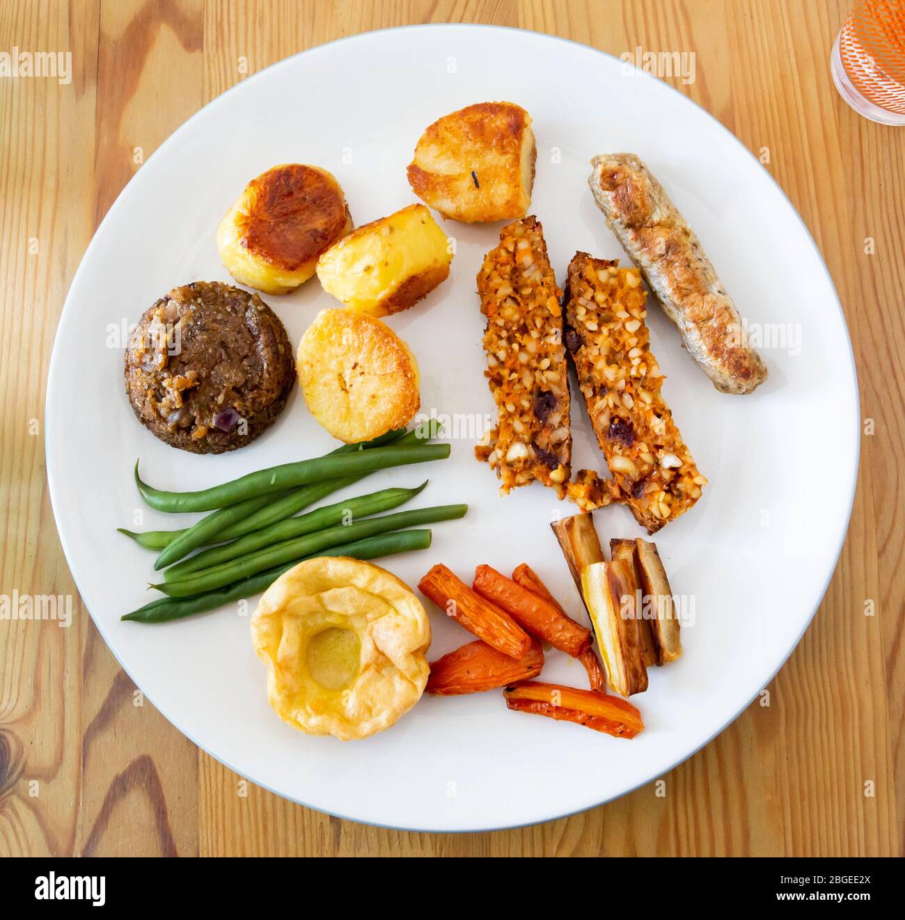 Vegan roast dinner on a white plate Stock Photo Alamy