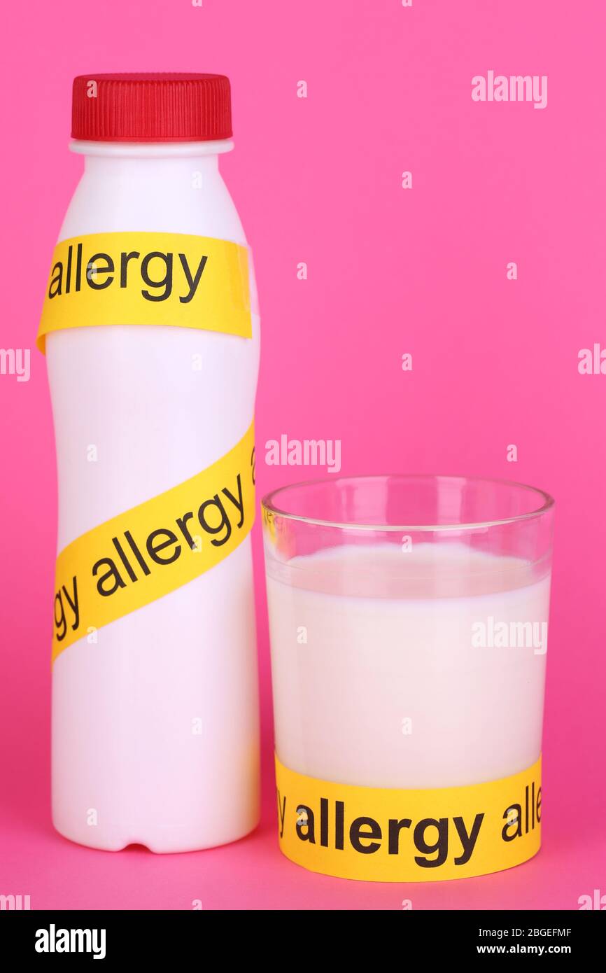 Milk allergy on pink background Stock Photo Alamy