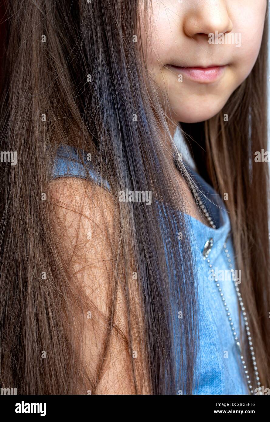 The girl has dyed her hair with blue chalk for hair. Entertainment at