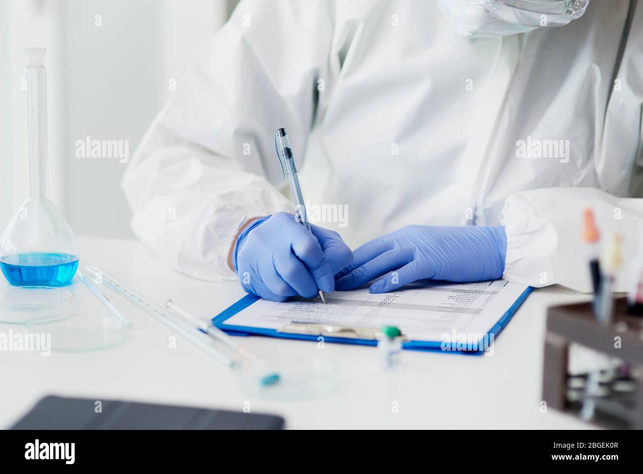 Technician making notes of medical exam Stock Photo