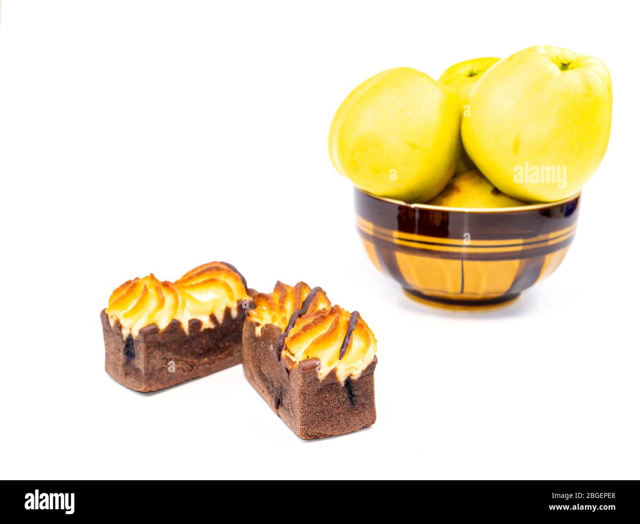 Cake and apples in a plate on a white background. Stock Photo