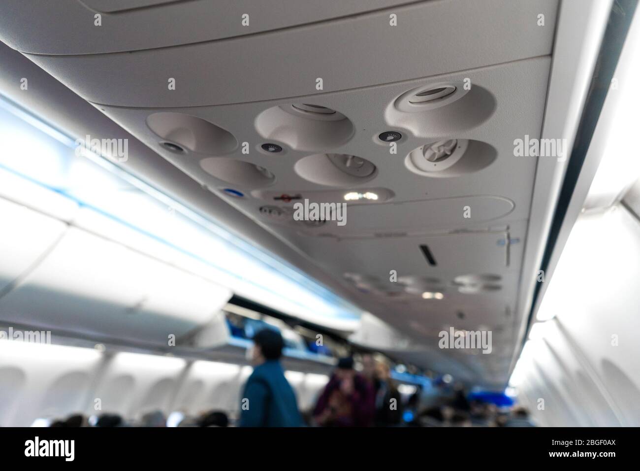 Control panel for ventilation and lighting in a passenger seat in an