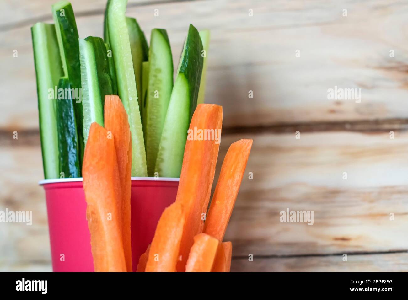 Chopped cucumber in a glass. Healthy food. Vegetable snack Stock Photo