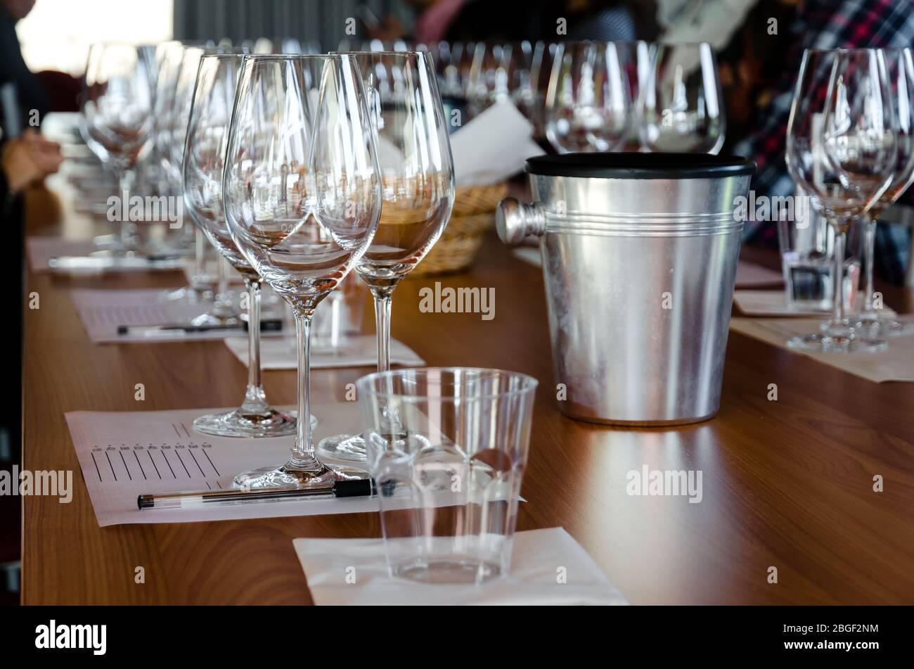 Table with glasses ready for wine tasting in a winery of Langhe (Italy) Stock Photo