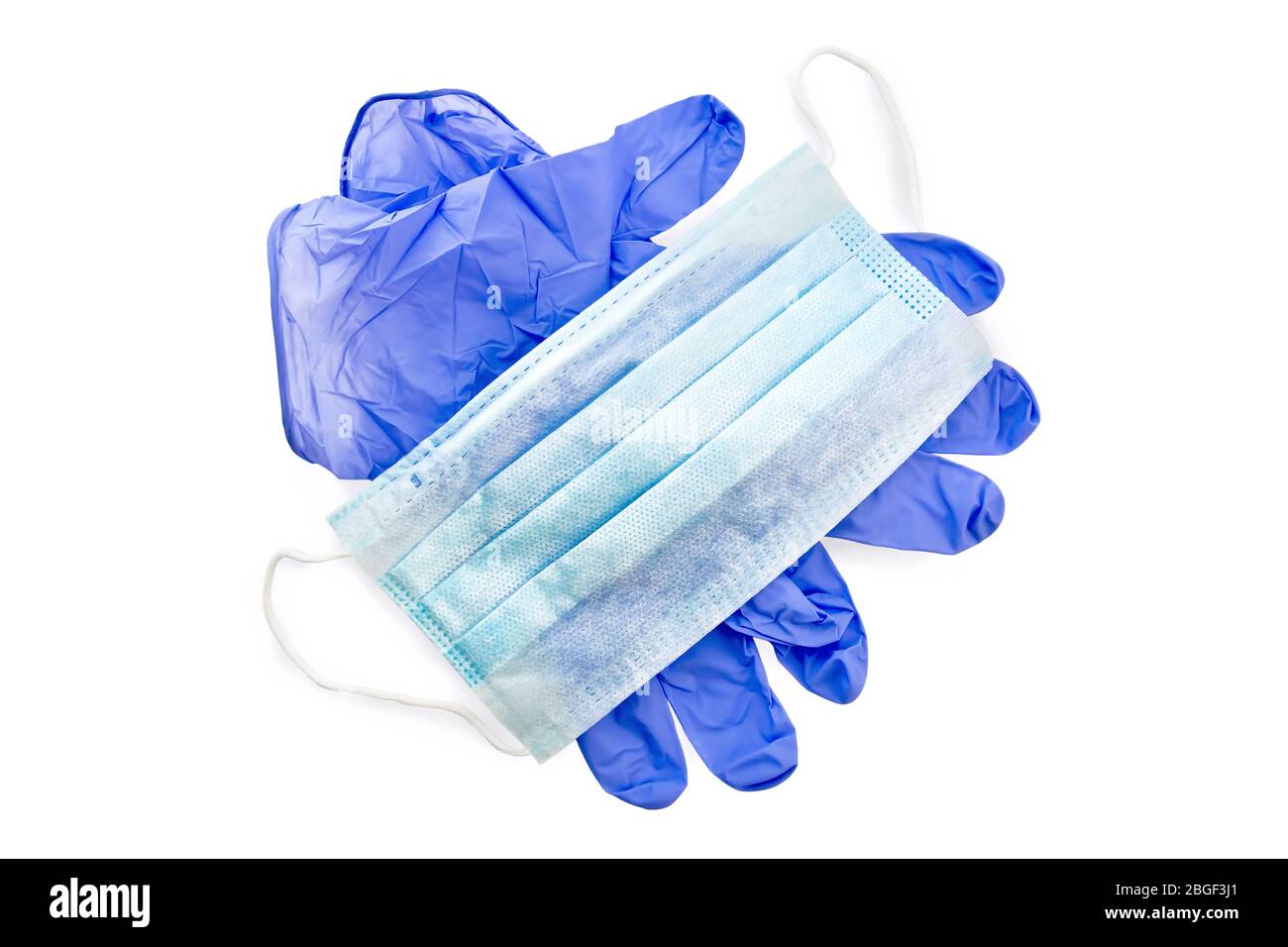 Blue latex gloves and medical disposable mask isolated on white background Stock Photo