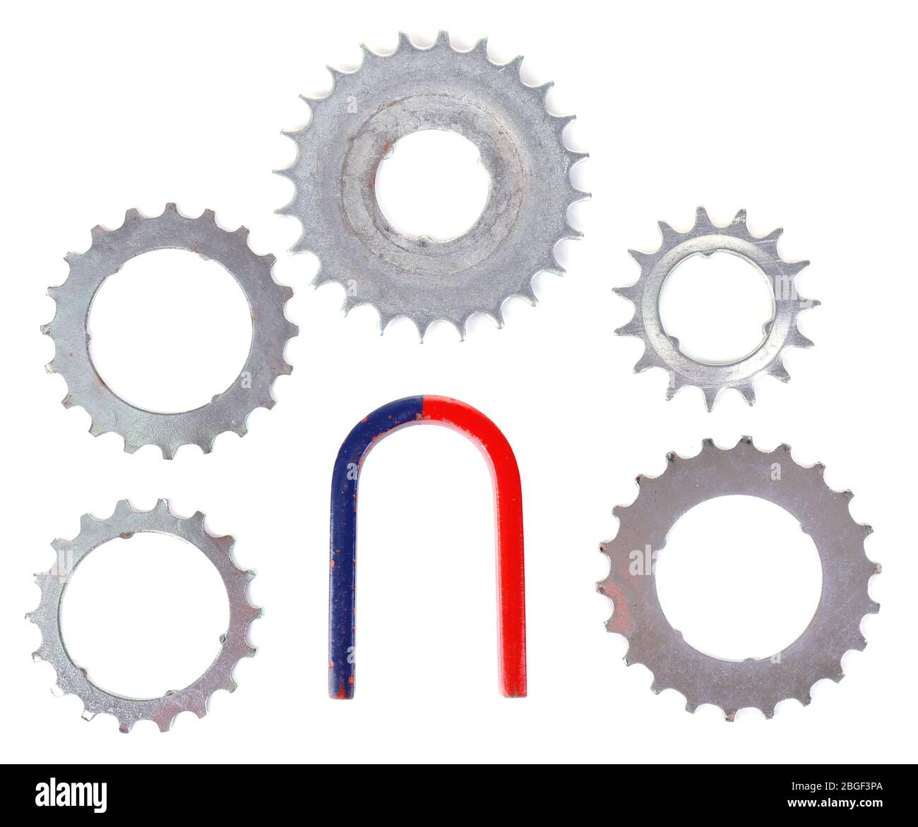 Magnet and metal gears isolated on white Stock Photo - Alamy