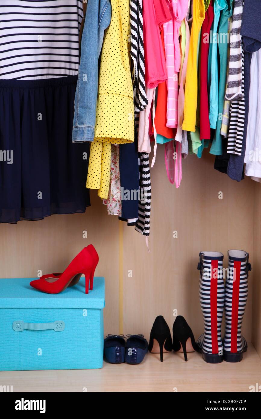 Colorful clothes hanging in wardrobe Stock Photo Alamy
