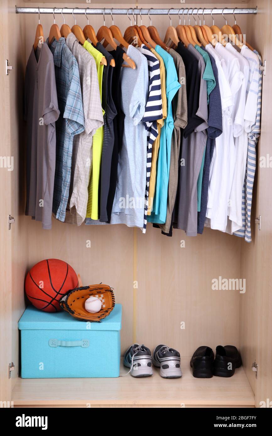 Colorful clothes hanging in wardrobe Stock Photo Alamy
