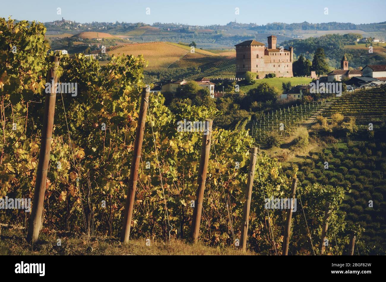 Sunset in autumn, during harvest time, at the castle of Grinzane Cavour, surrounded by the vineyards of Langhe, wine district of Italy Stock Photo