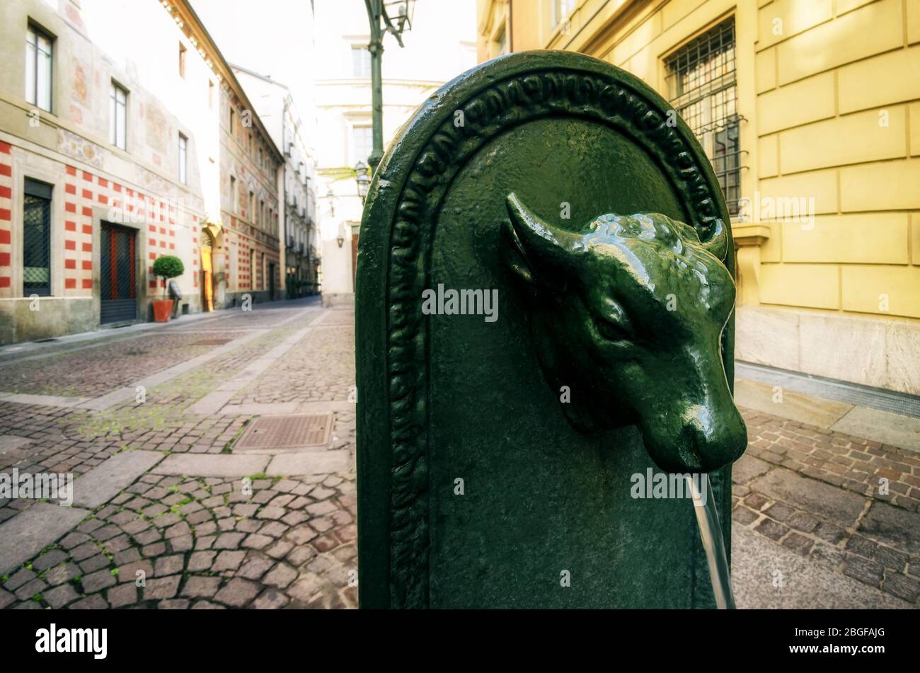 Toret, typical public fountain of Turin (Italy). There are almost 800 'toret' in the city, all made of cast iron and with bull shape in XIX century Stock Photo