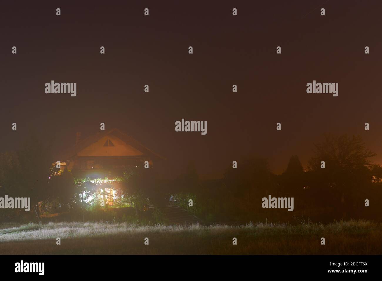 night photography with a house Stock Photo - Alamy