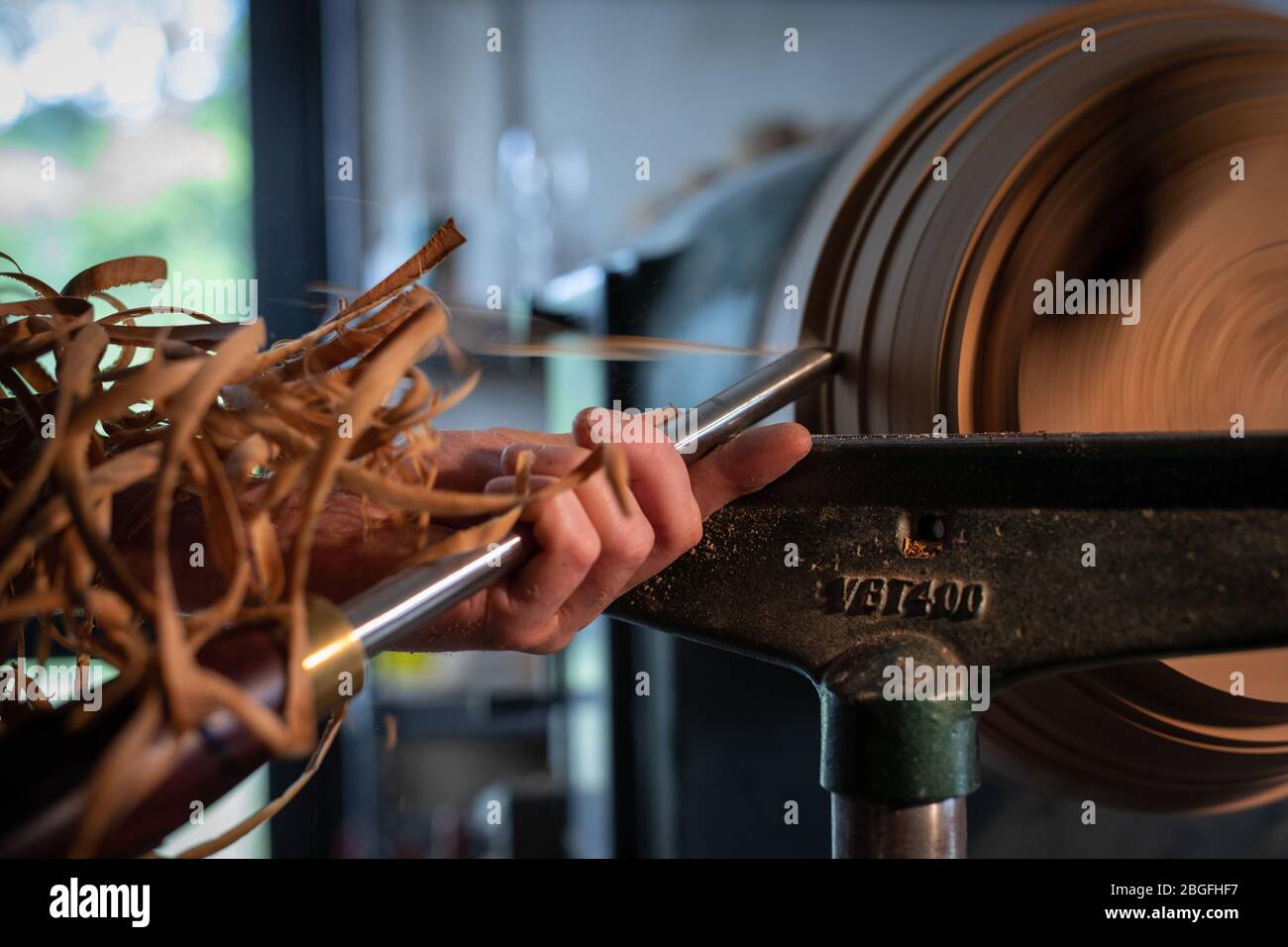 A wood turning lathe in action. Stock Photo