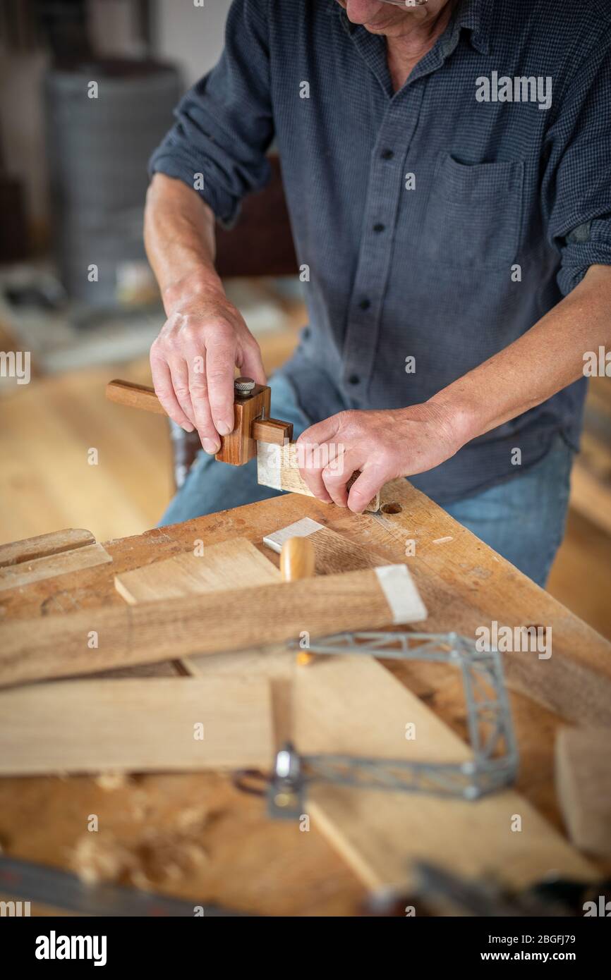 A carpenter at his workbench. Stock Photo