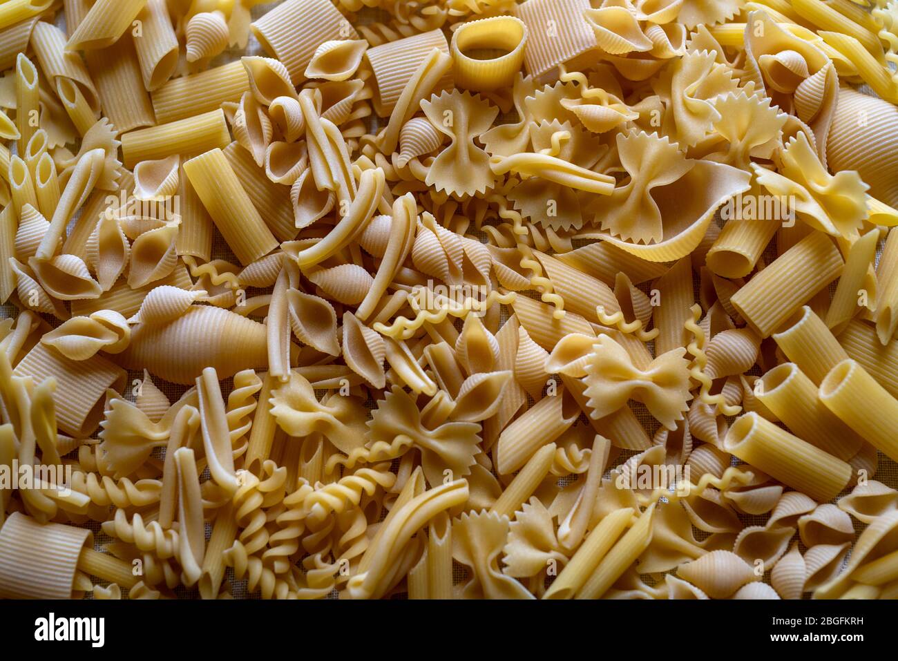 Variety of types and shapes of dry Italian short cut pasta Stock Photo Alamy